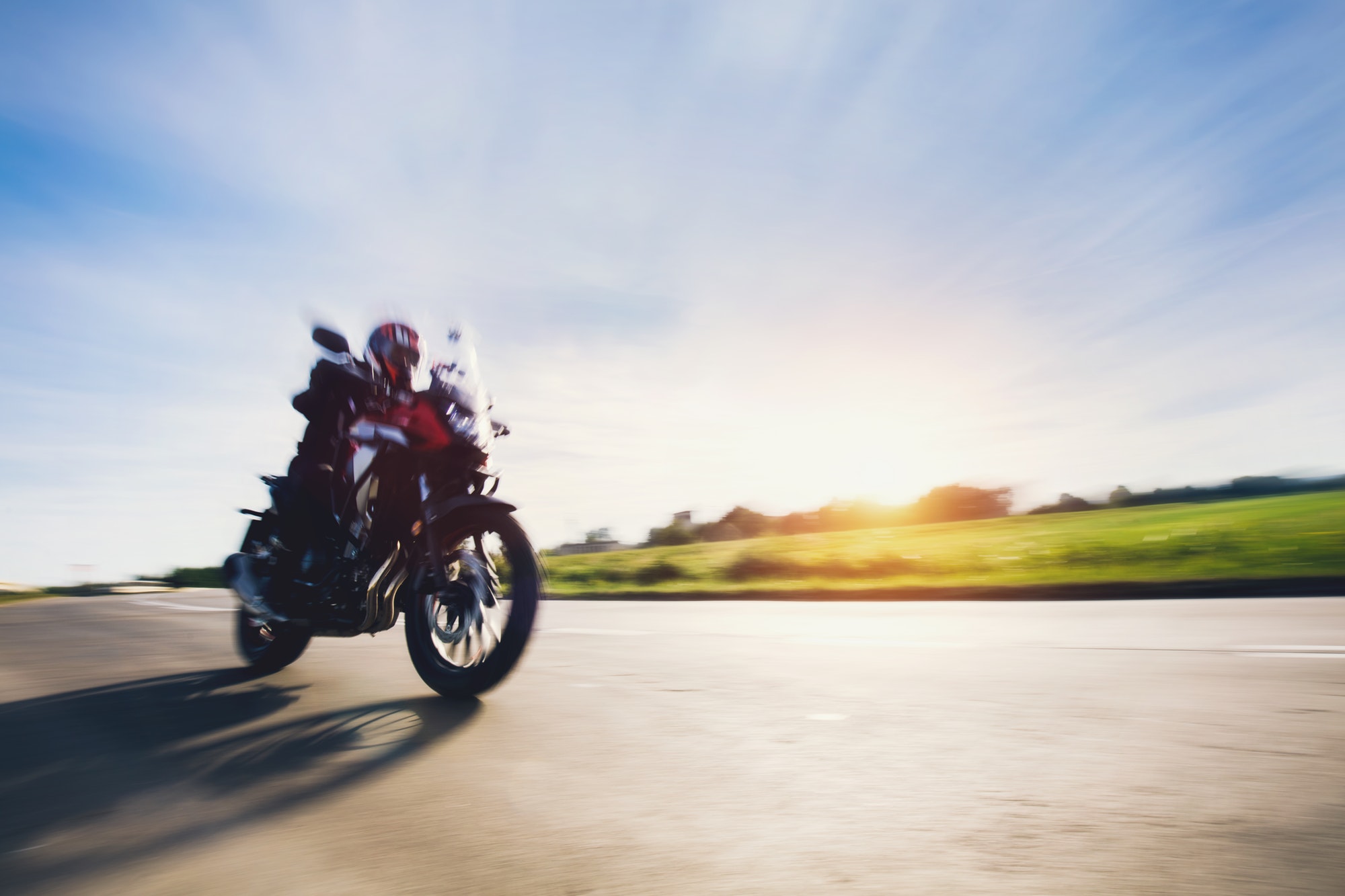 Drive a motorbike. Fast motorcycle in motion on asphalt road.